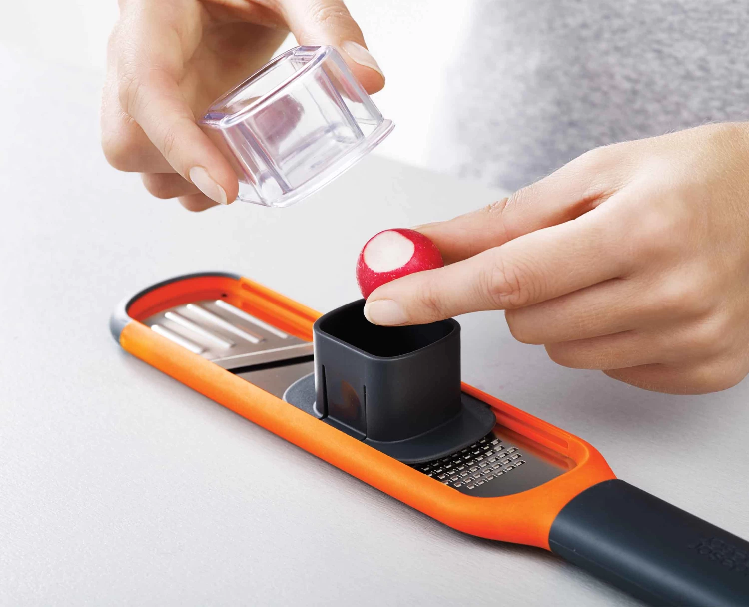Joseph Joseph Handi-Grate™ Orange 2-in-1 Mini Grater & Slicer 7 Joseph Joseph Handi-Grate™ Orange 2-in-1 Mini Grater & Slicer - Image 7